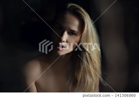 Peaceful morning moment. Woman in towel sits on bed looking outside. Calm thoughts, hotel stay, spa retreat, self-care, relaxation, wellness, natural light, wooden room, simple beauty. Peaceful morning moment. Woman in towel sits on bed looking outside. Calm thoughts, hotel stay, spa retreat, self-care, relaxation, wellness, natural light, wooden room, simple beauty. 141306860