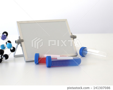 Medical laboratory scene with sample tubes, molecular model and blank display board with space for text. Healthcare composition for chemistry studies and infectious disease research concepts. Medical laboratory scene with sample tubes, molecular model and blank display board with space for text. Healthcare composition for chemistry studies and infectious disease research concepts. 141307086