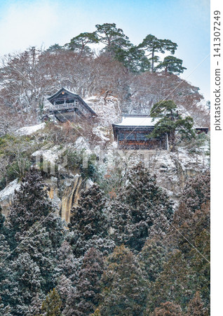 Risshaku-ji Temple in Yamagata in Winter: The Godai-do and Kaisan-do Halls built on the mountain. Risshaku-ji Temple in Yamagata in Winter: The Godai-do and Kaisan-do Halls built on the mountain. 141307249