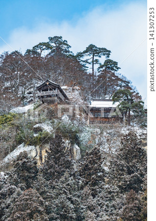 Risshaku-ji Temple in Yamagata in Winter: The Godai-do and Kaisan-do Halls built on the mountain. Risshaku-ji Temple in Yamagata in Winter: The Godai-do and Kaisan-do Halls built on the mountain. 141307253