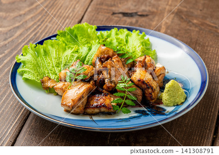 A platter of fragrant charcoal-grilled chicken and eel. A platter of fragrant charcoal-grilled chicken and eel. 141308791