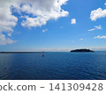 A photo of Sarushima Island and the sea of Tokyo Bay taken from a ferry. 141309428