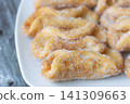 Traditional Spanish Pestinos With Sugar on Plate 141309663