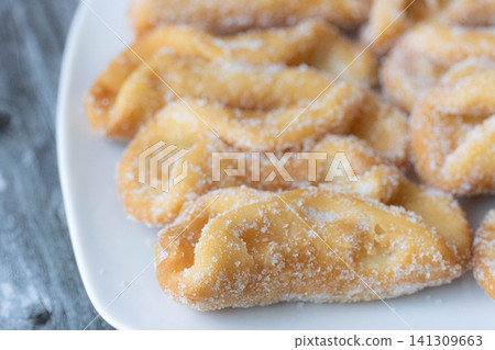 Traditional Spanish Pestinos With Sugar on Plate Traditional Spanish Pestinos With Sugar on Plate 141309663