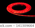 Red LED strip light glowing on black background, flexible neon style lighting 141309664