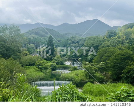 Clear stream flowing through the mountain Clear stream flowing through the mountain 141310346