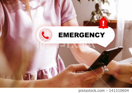 Person using a phone to report an emergency situation during daylight hours at home Person using a phone to report an emergency situation during daylight hours at home 141310604