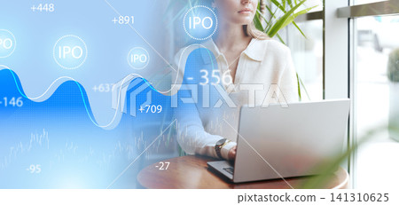 Investors track IPO performance at a cafe while working on laptops in a busy city setting Investors track IPO performance at a cafe while working on laptops in a busy city setting 141310625