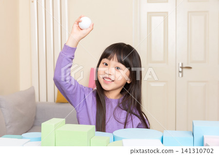 Asian little girl building tower with blocks at home, creative play and STEM learning concept Asian little girl building tower with blocks at home, creative play and STEM learning concept 141310702