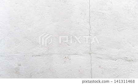 Minimalist background and textured weathered surface of a gray cement wall. Faint cracks add character making it a perfect neutral backdrop for various design applications. Minimalist background and textured weathered surface of a gray cement wall. Faint cracks add character making it a perfect neutral backdrop for various design applications. 141311468
