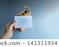 Hand holding a thank you card 141311934