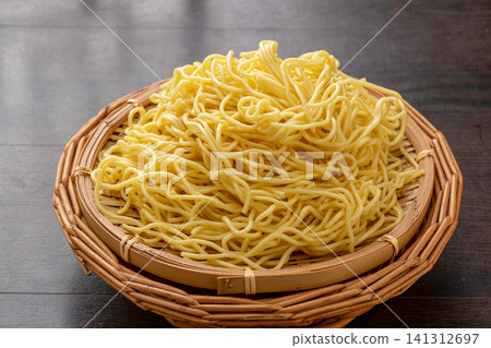 pre-cooked alkaline wheat noodles for traditional Wuhan hot dry noodles served in a bamboo basket pre-cooked alkaline wheat noodles for traditional Wuhan hot dry noodles served in a bamboo basket 141312697