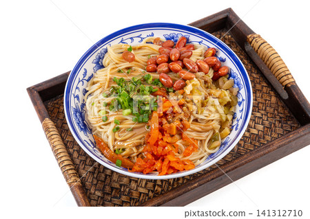 traditional Wuhan hot dry noodles with rich sesame paste, peanuts and pickled vegetables in a ceramic bowl. traditional Wuhan hot dry noodles with rich sesame paste, peanuts and pickled vegetables in a ceramic bowl. 141312710