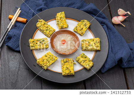 chinese traditional pan-fried locust flower pancake, round savory pastry. chinese traditional pan-fried locust flower pancake, round savory pastry. 141312733