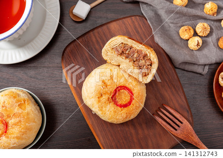 baked flaky Chinese flatbread stuffed with savory minced beef, traditional meat pastry. baked flaky Chinese flatbread stuffed with savory minced beef, traditional meat pastry. 141312743