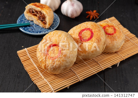 authentic Tianjin Shaobing, crispy baked sesame biscuits filled with seasoned beef. authentic Tianjin Shaobing, crispy baked sesame biscuits filled with seasoned beef. 141312747