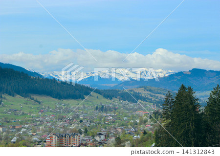 Panoramic view of Verkhovyna town and snowy Carpathian Mountains in Ukraine. Panoramic view of Verkhovyna town and snowy Carpathian Mountains in Ukraine. 141312843