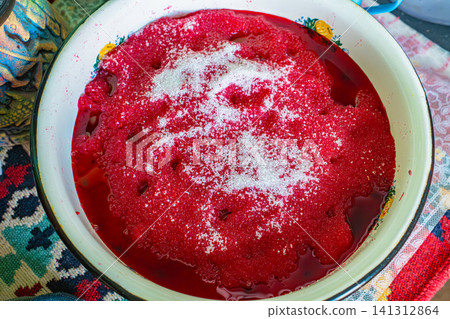 Candied sugared raspberries with white sugar crystals in bowl for homemade jam making, food preservation and cooking concept Candied sugared raspberries with white sugar crystals in bowl for homemade jam making, food preservation and cooking concept 141312864
