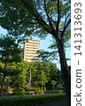A streetscape with apartment buildings around Yokohama Ryokuen-toshi Station. 141313693