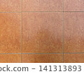 Brown terracotta ceramic floor tiles texture background, top view. 141313893