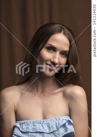 portrait of a young beautiful woman on a dark background portrait of a young beautiful woman on a dark background 141314030