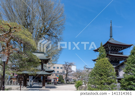 A view of the three-story pagoda of Kokubunji Temple and the blue sky in Takayama City, Gifu Prefecture. A view of the three-story pagoda of Kokubunji Temple and the blue sky in Takayama City, Gifu Prefecture. 141314361