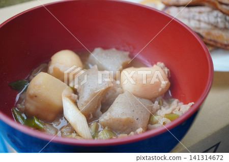 A close-up of a hearty imoni-style soup containing taro and konjac. A close-up of a hearty imoni-style soup containing taro and konjac. 141314672