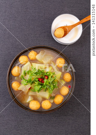 simmered winter melon soup with golden fried fish balls and cilantro simmered winter melon soup with golden fried fish balls and cilantro 141315148