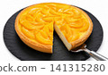 Peach Cheesecake with Fresh Peach Topping on White Background 141315280