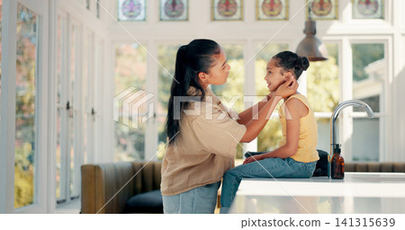 Mother, daughter and getting ready in kitchen or home with backpack, ear check and greeting. Morning, girl child and mom with prepare for education, learning and school with love, care and helping Mother, daughter and getting ready in kitchen or home with backpack, ear check and greeting. Morning, girl child and mom with prepare for education, learning and school with love, care and helping 141315639
