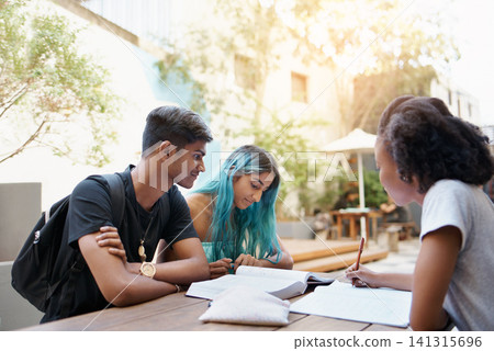 Students, writing and study outdoor at university with books, reading and learning for education on campus. Friends, gen z people and group research with smile, diversity and college break by table Students, writing and study outdoor at university with books, reading and learning for education on campus. Friends, gen z people and group research with smile, diversity and college break by table 141315696