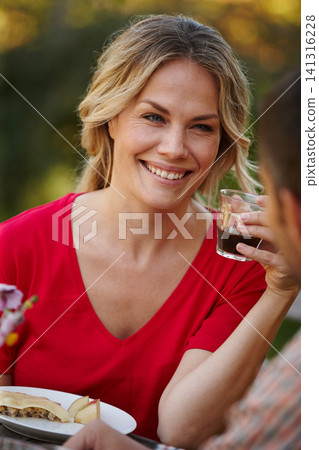 Woman, happy or smiling with cup on picnic date with partner for love, romance and memories together. Person, drinking and eating healthy meal with boyfriend for conversation, bonding or relationship Woman, happy or smiling with cup on picnic date with partner for love, romance and memories together. Person, drinking and eating healthy meal with boyfriend for conversation, bonding or relationship 141316228