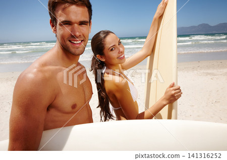Happy, portrait and couple with surfboard at the beach with love and water sport on holiday in summer. Surfing, sea and vacation with smile and bonding by waves with travel in Miami with people Happy, portrait and couple with surfboard at the beach with love and water sport on holiday in summer. Surfing, sea and vacation with smile and bonding by waves with travel in Miami with people 141316252