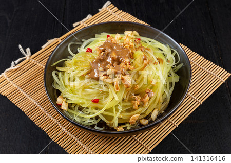 chilled Shredded Celtuce Salad Topped with Rich and Savory Sesame Sauce 141316416
