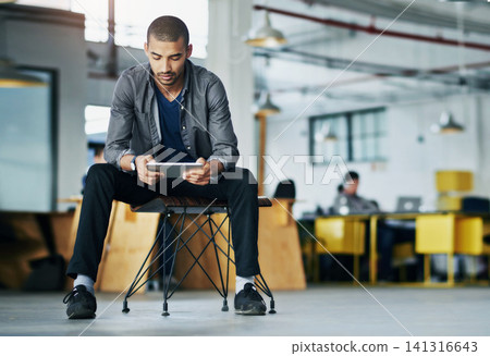 Business, graphic designer and man on chair, tablet and typing with connection, relax and website info. Person, creative agency and consultant with technology, network and social media in office Business, graphic designer and man on chair, tablet and typing with connection, relax and website info. Person, creative agency and consultant with technology, network and social media in office 141316643