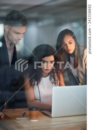 Business people, planning and teamwork on laptop of report, brainstorming or problem solving in office glass window. Group of women, man or accountant reading project information or news on computer 141316692