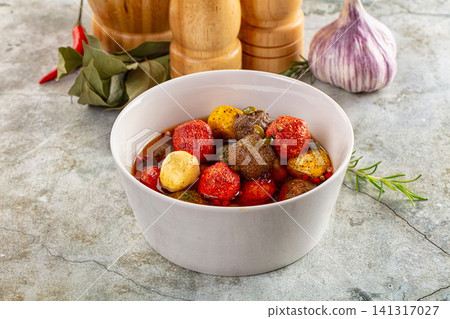 Colorful marinated meatballs in white bowl with garlic rosemary and spices Colorful marinated meatballs in white bowl with garlic rosemary and spices 141317027