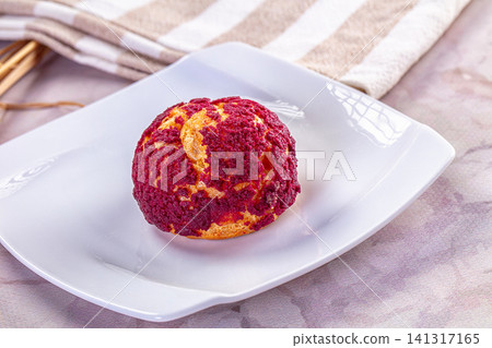 Red velvet cream puff on white plate with striped cloth background Red velvet cream puff on white plate with striped cloth background 141317165