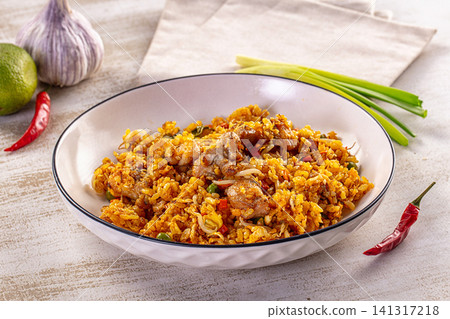Fried rice with chicken and vegetables in white bowl Fried rice with chicken and vegetables in white bowl 141317218