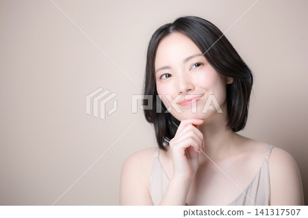 Japanese women contemplating skincare and beauty: Natural portraits evoking the image of beautiful skin. 141317507