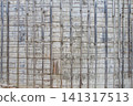 Industrial details, the texture of the aged exterior wall with visible concrete formwork marks and reinforcing battens. 141317513