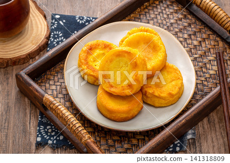 pan fried coarse grain corn cakes with golden crispy crust 141318809