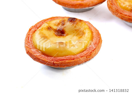 baked Portuguese egg tarts flaky pastry shells with strawberry custard filling baked Portuguese egg tarts flaky pastry shells with strawberry custard filling 141318832