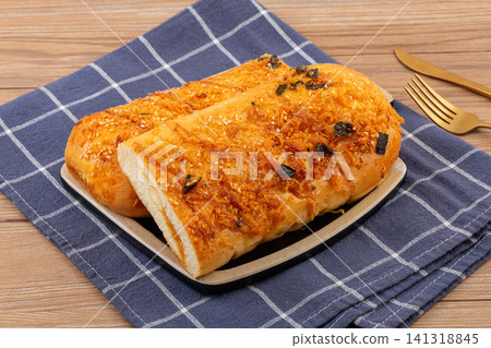 savory meat floss bread stick topped with shredded seaweed and mayonnaise savory meat floss bread stick topped with shredded seaweed and mayonnaise 141318845