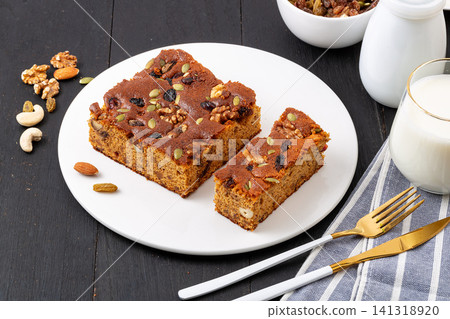 traditional Chinese jujube cake slices topped with mixed nuts and seeds traditional Chinese jujube cake slices topped with mixed nuts and seeds 141318920
