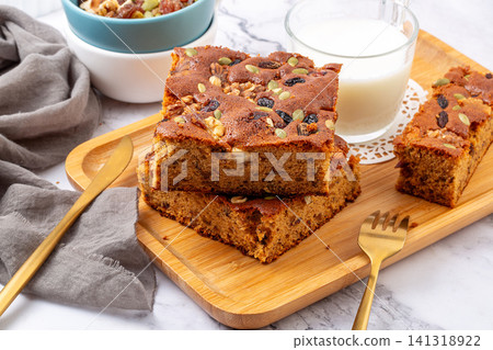 traditional Chinese jujube cake slices topped with mixed nuts and seeds traditional Chinese jujube cake slices topped with mixed nuts and seeds 141318922
