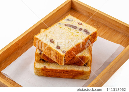 sliced soft white bread toast with red bean swirls and coconut flavor 141318962