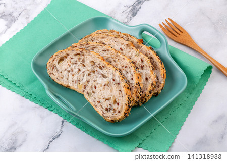 slices of artisanal European sourdough bread with flaxseed and walnut 141318988