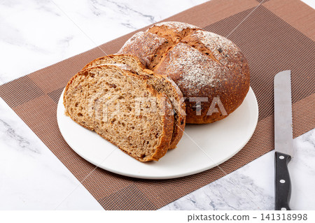 whole rye malt multigrain bread loaves with cereal seeds dusting 141318998