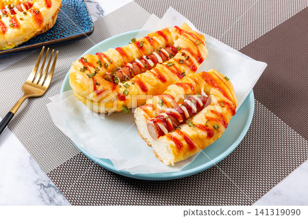 savory green onion sausage bun topped with mayonnaise and ketchup savory green onion sausage bun topped with mayonnaise and ketchup 141319090
